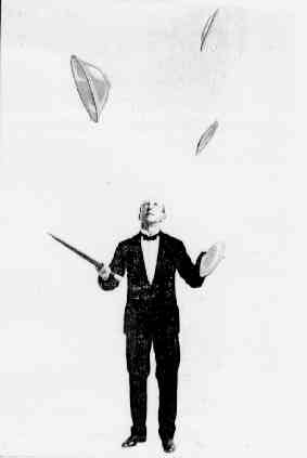 [juggling varied objects]